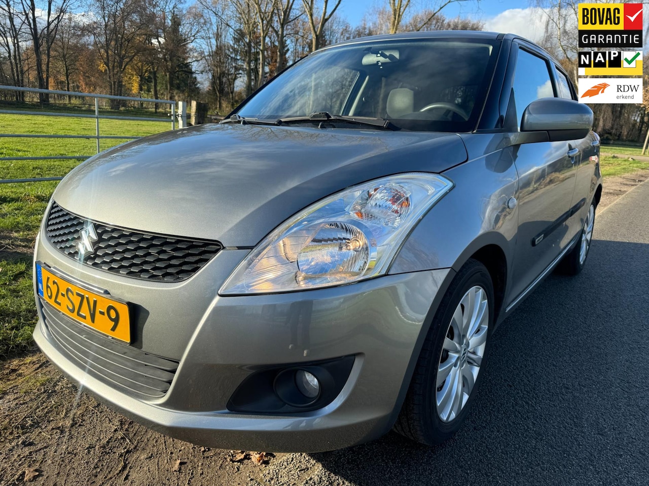 Suzuki Swift - 1.2 Exclusive EASSS met climate control en stoelverwarming - AutoWereld.nl