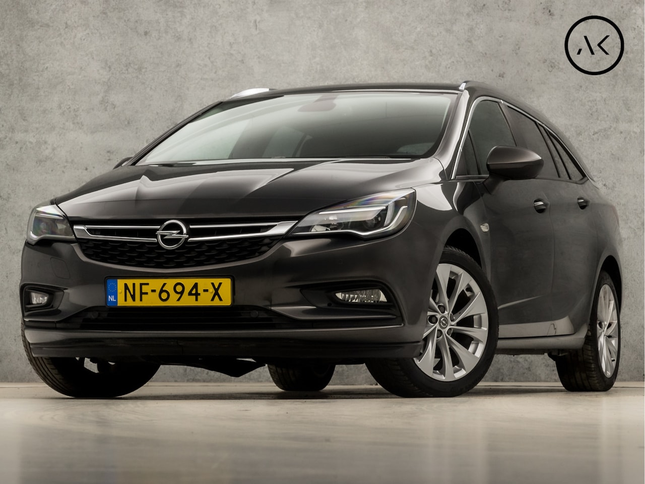 Opel Astra Sports Tourer - 1.0 Edition (APPLE CARPLAY, NAVIGATIE, CLIMATE, GETINT GLAS, SPORTSTOELEN, ARMSTEUN, PARKE - AutoWereld.nl