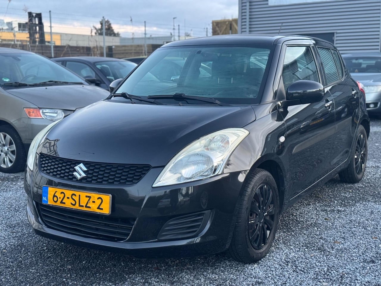 Suzuki Swift - 1.2 Comfort EASSS Airco 5 Deurs Zwart Elektrisch Ramen - AutoWereld.nl