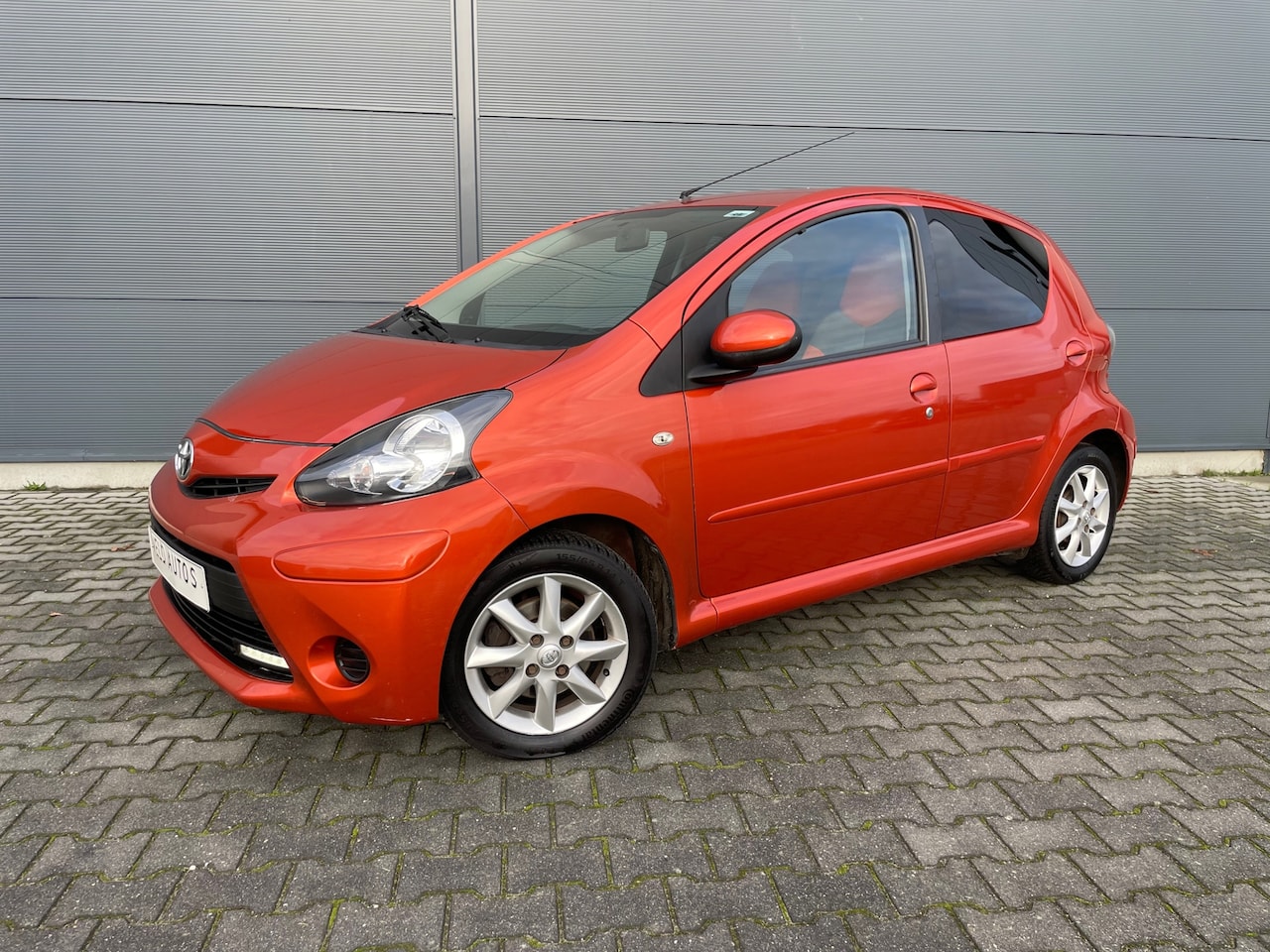 Toyota Aygo - 1.0 VVT-i Dynamic Orange bouwjaar 2013 ( nw apk ) - AutoWereld.nl