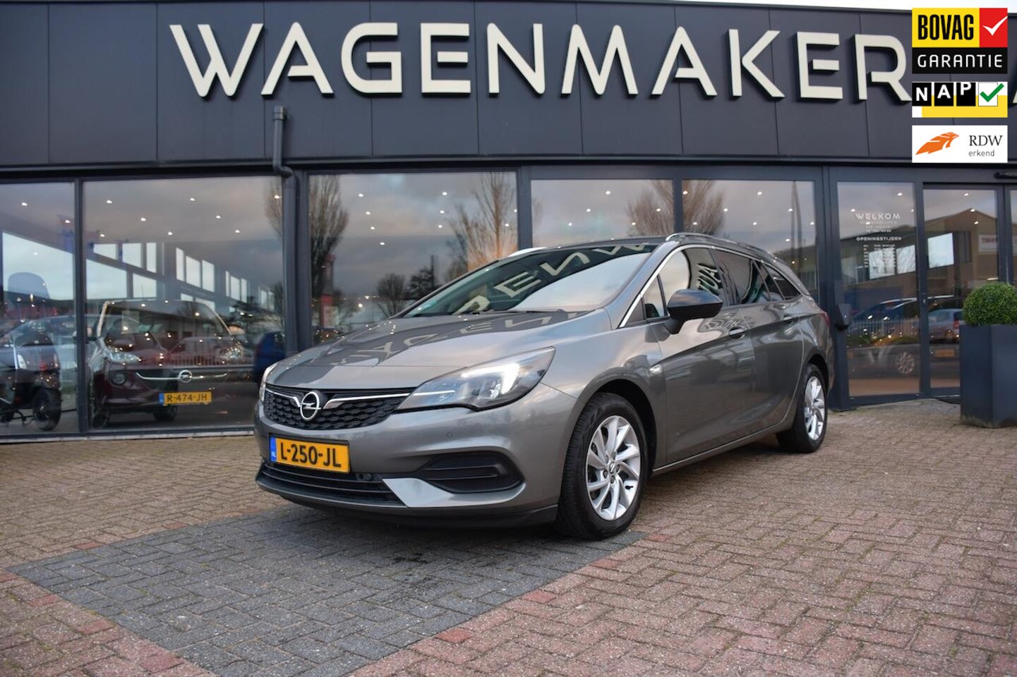 Opel Astra Sports Tourer - 1.2 Business Elegance NAVI|Carplay - AutoWereld.nl