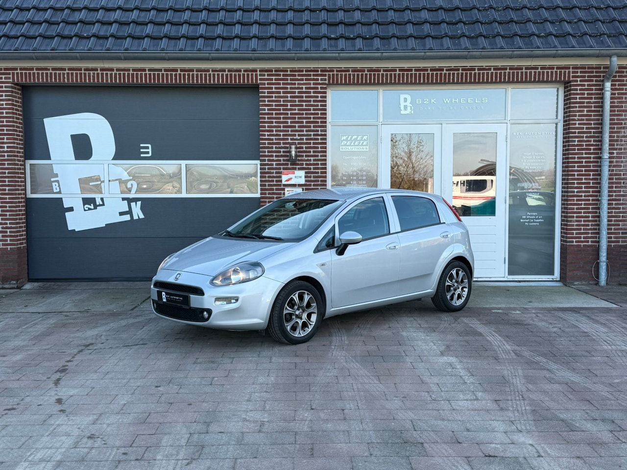 Fiat Punto Evo - 0.9 TwinAir Lounge | Cruise | Airco | NAP | - AutoWereld.nl