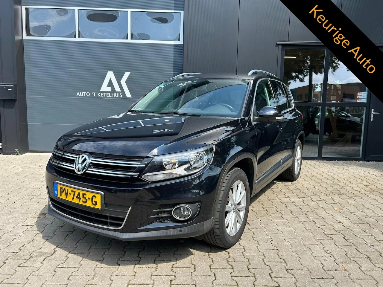 Volkswagen Tiguan - 1.4 TSI Sport&Style - AutoWereld.nl