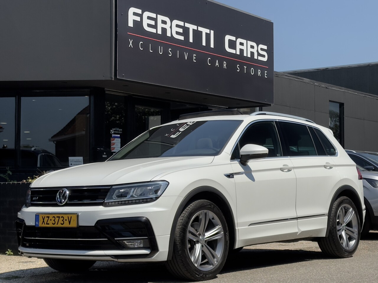 Volkswagen Tiguan - 1.5 TSI ACT AUT7 R-LINE. PANODAK NAVI AIRCO VIRTUAL-DASH LED LMV PDC - AutoWereld.nl