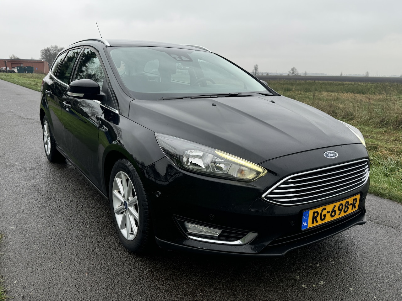 Ford Focus Wagon - 1.0 Titanium NAVI/ECC/STUURVERW/CAMERA - AutoWereld.nl