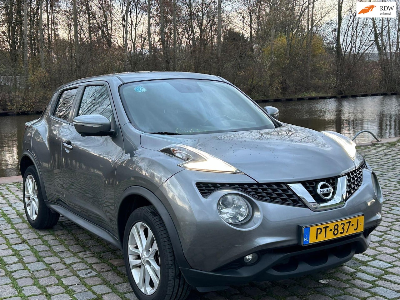 Nissan Juke - 1.6 Acenta Automaat achteruit camera cruis control airco - AutoWereld.nl