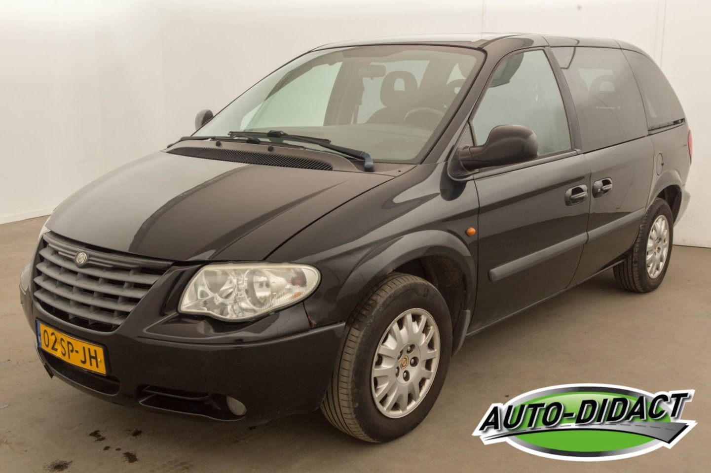 Chrysler Voyager - 2.4i SE Luxe 7 pers. - AutoWereld.nl