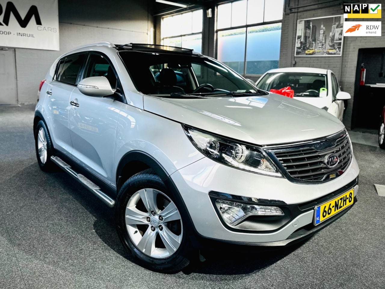 Kia Sportage - 2.0 X-ecutive Plus Pack - Automaat - Climate - Cruise - Pano- Treekhaak - AutoWereld.nl