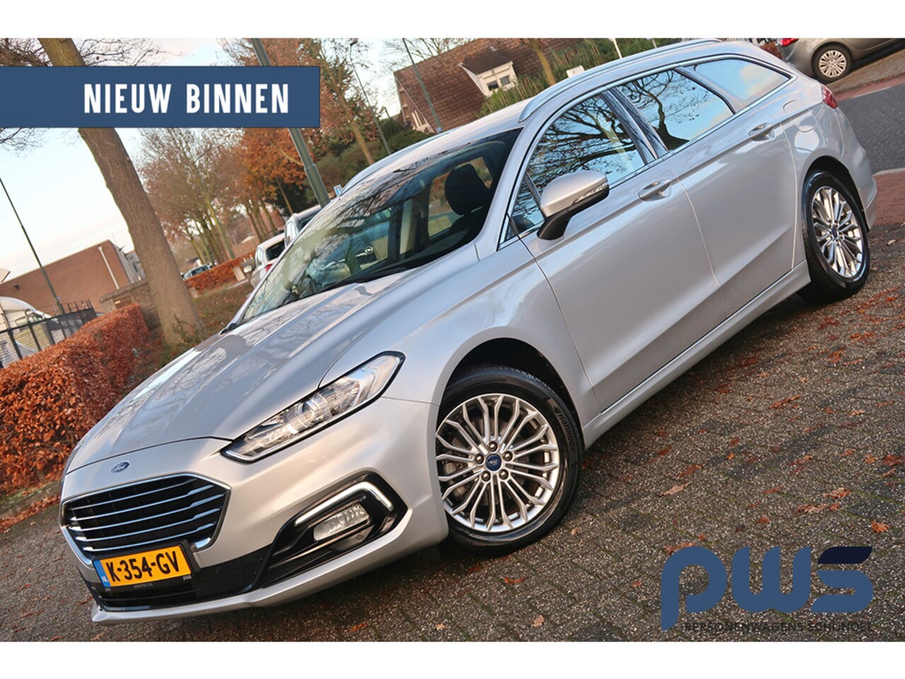 Ford Mondeo Wagon - 2.0 IVCT HEV Titanium Navi / Cruise / Clima / Carplay / PDC/ Led / St. verwar. / 1e eig / - AutoWereld.nl