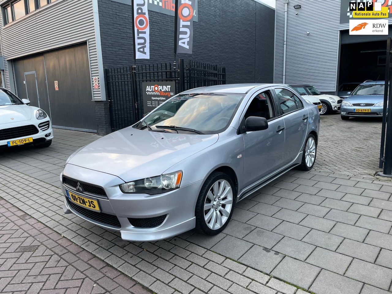 Mitsubishi Lancer Sports Sedan - 1.5 Inform Intro Edition Trekhaak Airco NAP APK - AutoWereld.nl