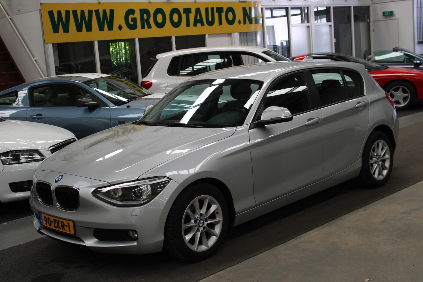 BMW 1-serie - 114i Business+ 1e eigenaar, Airco, Cruise control, Leder interieur - AutoWereld.nl