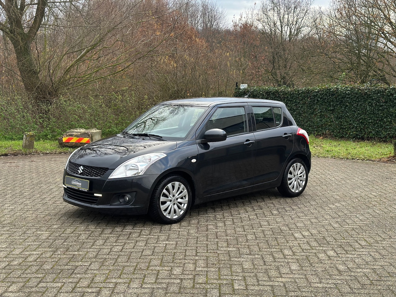 Suzuki Swift - 1.2 Exclusive EASSS KEYLESS I TREKHAAK I CRUISE I AIRCO - AutoWereld.nl