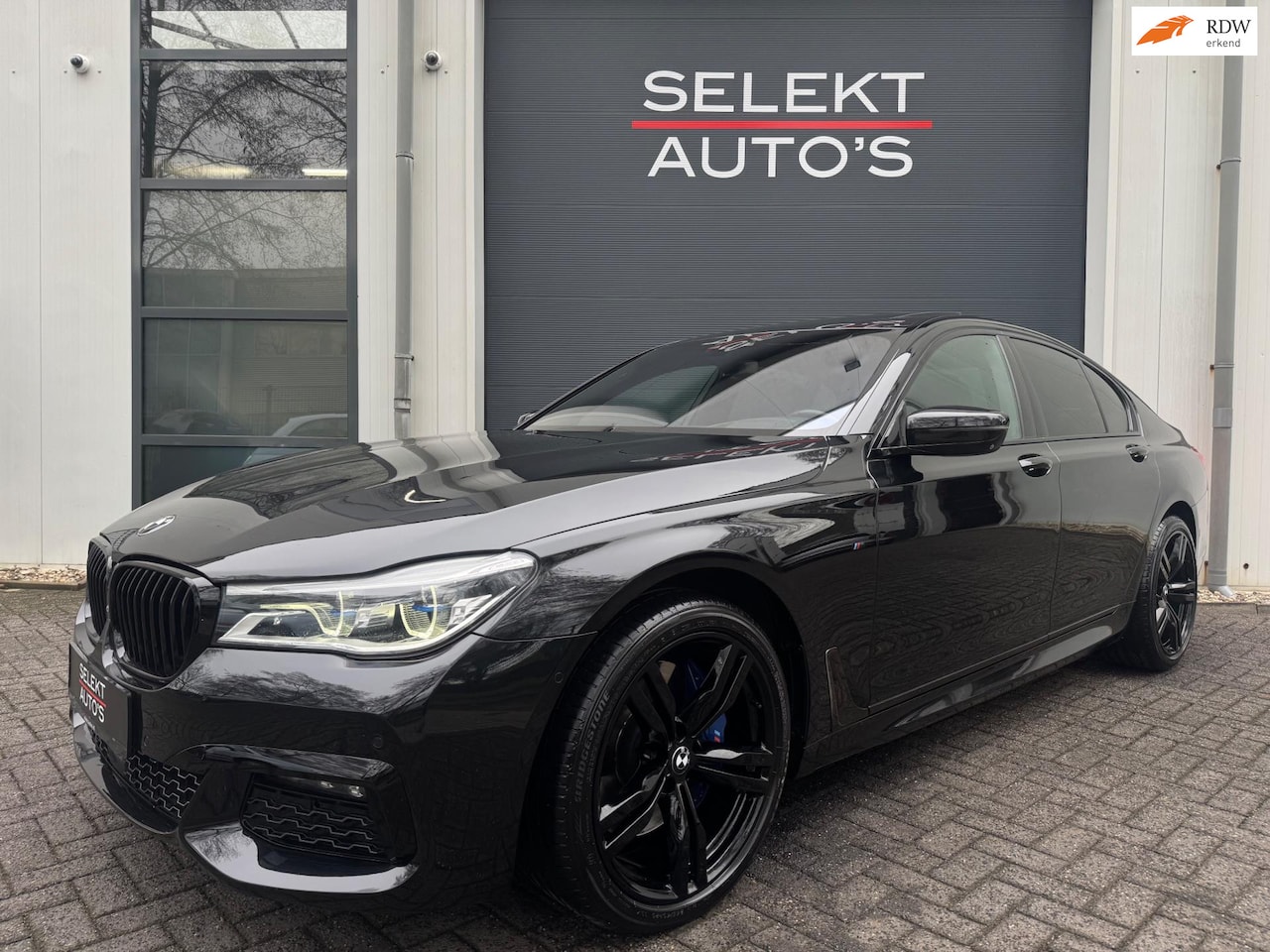 BMW 7-serie - 750 D X-Drive High Executive M-Pakket Schuifdak/B&O/Luchtvering/Leder/360/Navi/Bluetooth/L - AutoWereld.nl