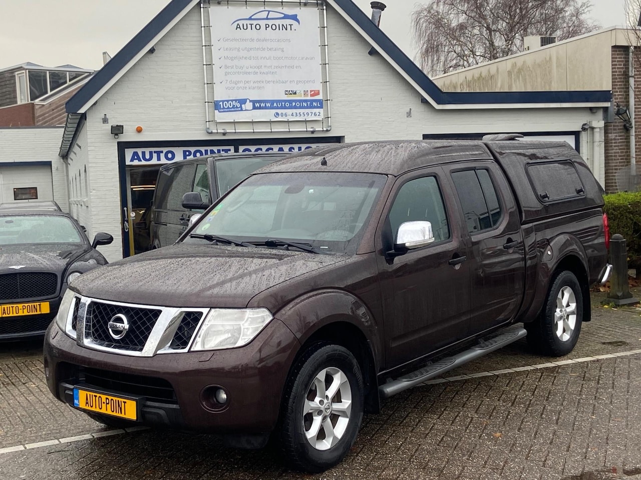 Nissan Navara - 2.5DCI 4X4/LONGBODY/5ZITS/NAV/CAMERA/MARGE - AutoWereld.nl