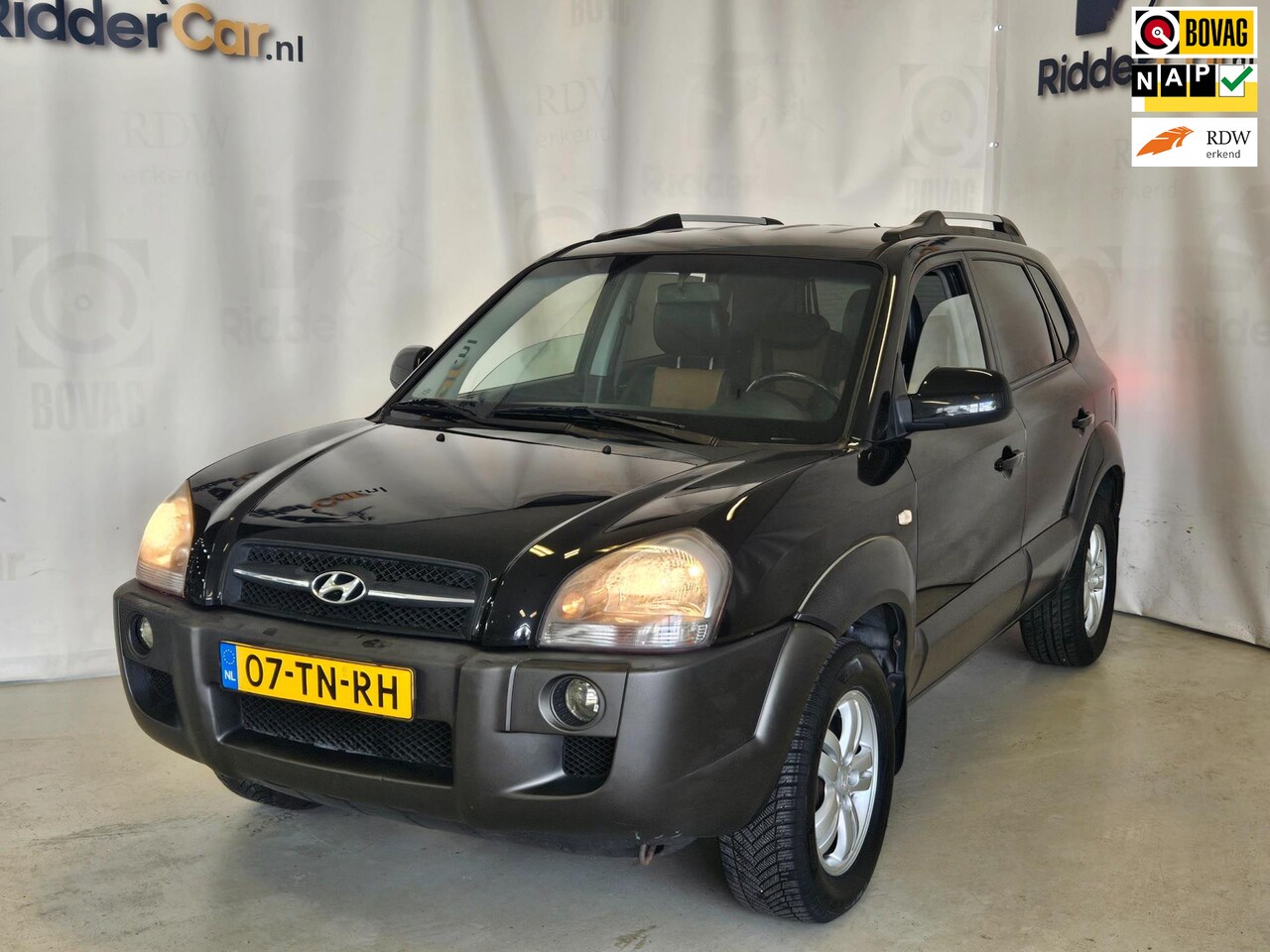 Hyundai Tucson - 2.0i Style Premium|NAP|AIRCO|CRUISE|APK6-25|PARK SENS|LEDER|AUDIO|VELGEN - AutoWereld.nl