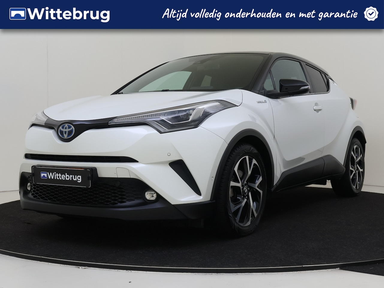 Toyota C-HR - 1.8 Hybrid Bi-Tone | Navigatie | Lederen bekleding | Camera - AutoWereld.nl