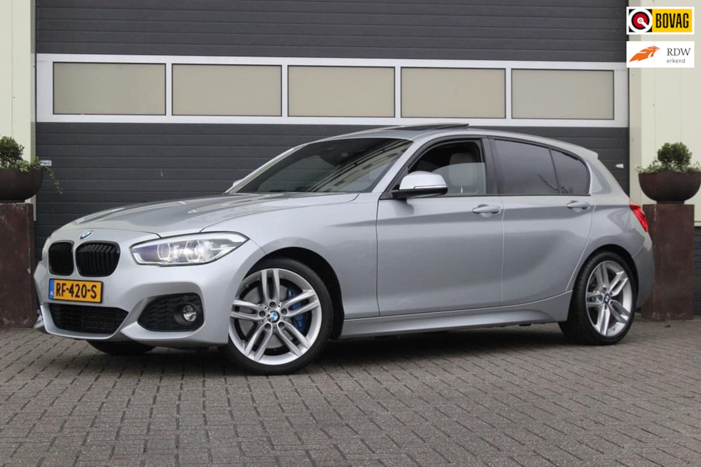 BMW 1-serie - 118i Edition M Sport Shadow High Executive | Glasdak | - AutoWereld.nl