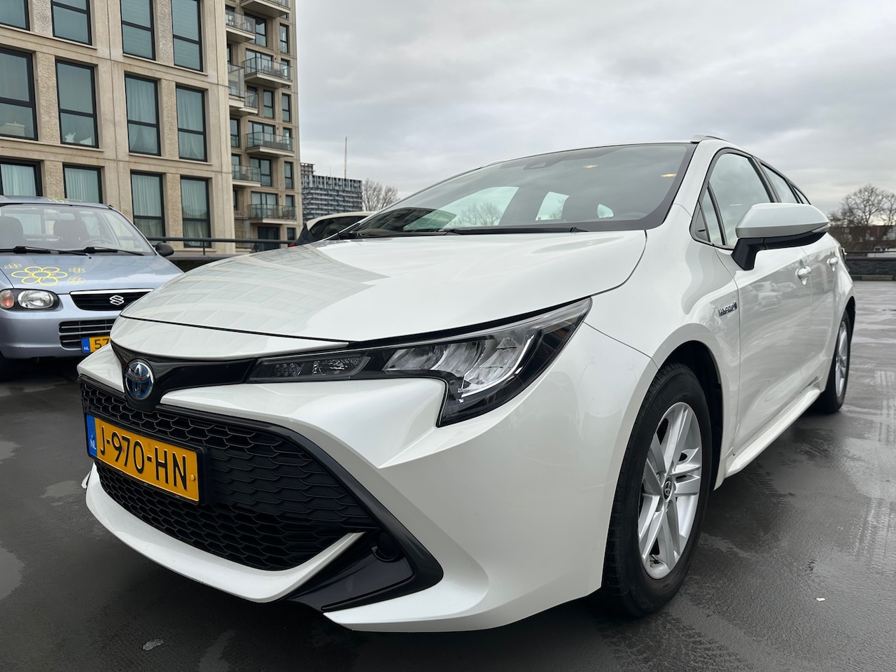 Toyota Corolla Touring Sports - 1.8 Hybrid Active Carplay Adaptief Cruise Lane Assist Camera Dealer OH! - AutoWereld.nl