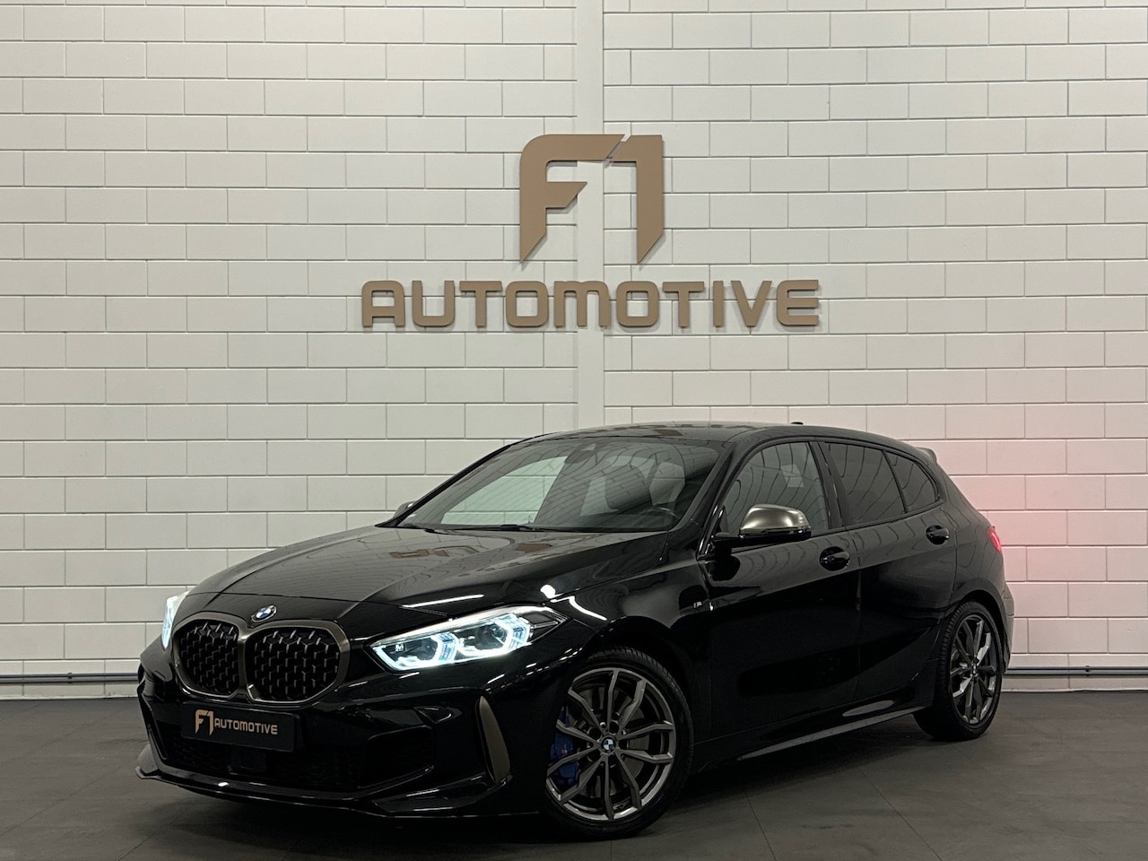 BMW 1-serie - M135i xDrive High Executive HuD|Sfeer|Keyless - AutoWereld.nl