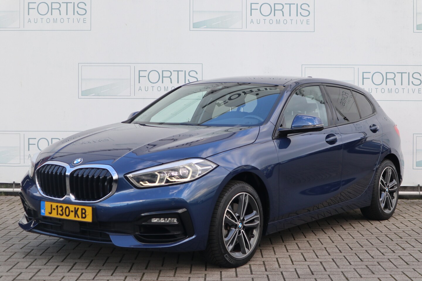 BMW 1-serie - 118i Executive NL Auto! Half Leder/ Cruise/ Carplay/ Virtual Cockpit/ LED/ LMV/ Navi/ PDC/ - AutoWereld.nl