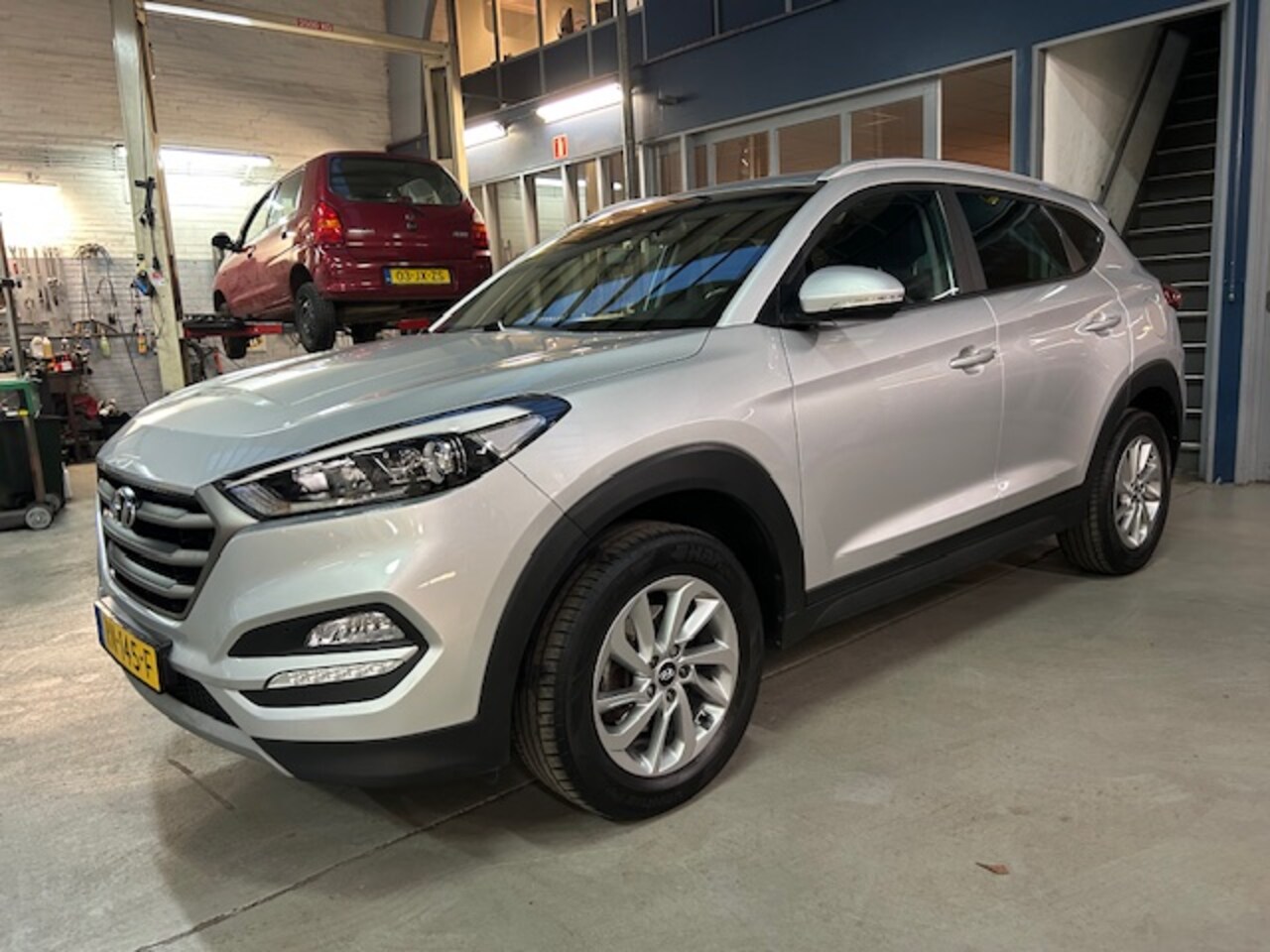 Hyundai Tucson - 1.6 GDi 132pk Anniversary Edition | Trekhaak | Navigatie | Camera | Climate control | LED - AutoWereld.nl