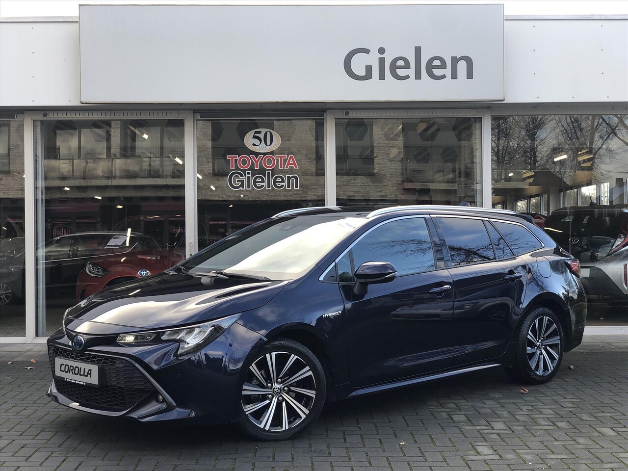 Toyota Corolla Touring Sports - 1.8 Hybrid Dynamic | Apple CarPlay/Android Auto, LED, Stoelverwarming, Keyless, Half leer - AutoWereld.nl