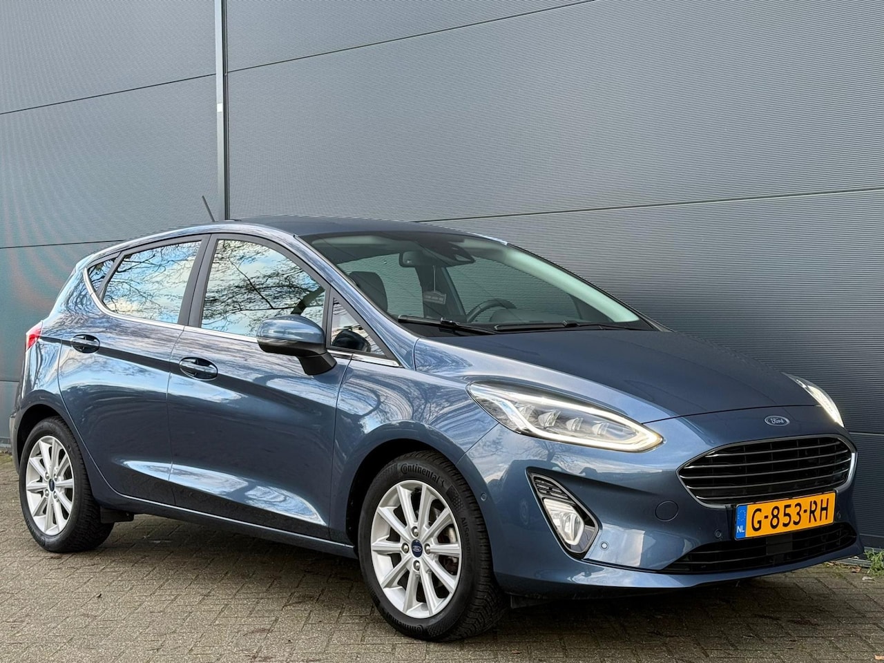 Ford Fiesta - 1.0 EcoBoost Titanium 1STE EIGENAAR | NAVI | CAMERA | CARPLAY | KEYLESS | KEYLESS | BTW - AutoWereld.nl