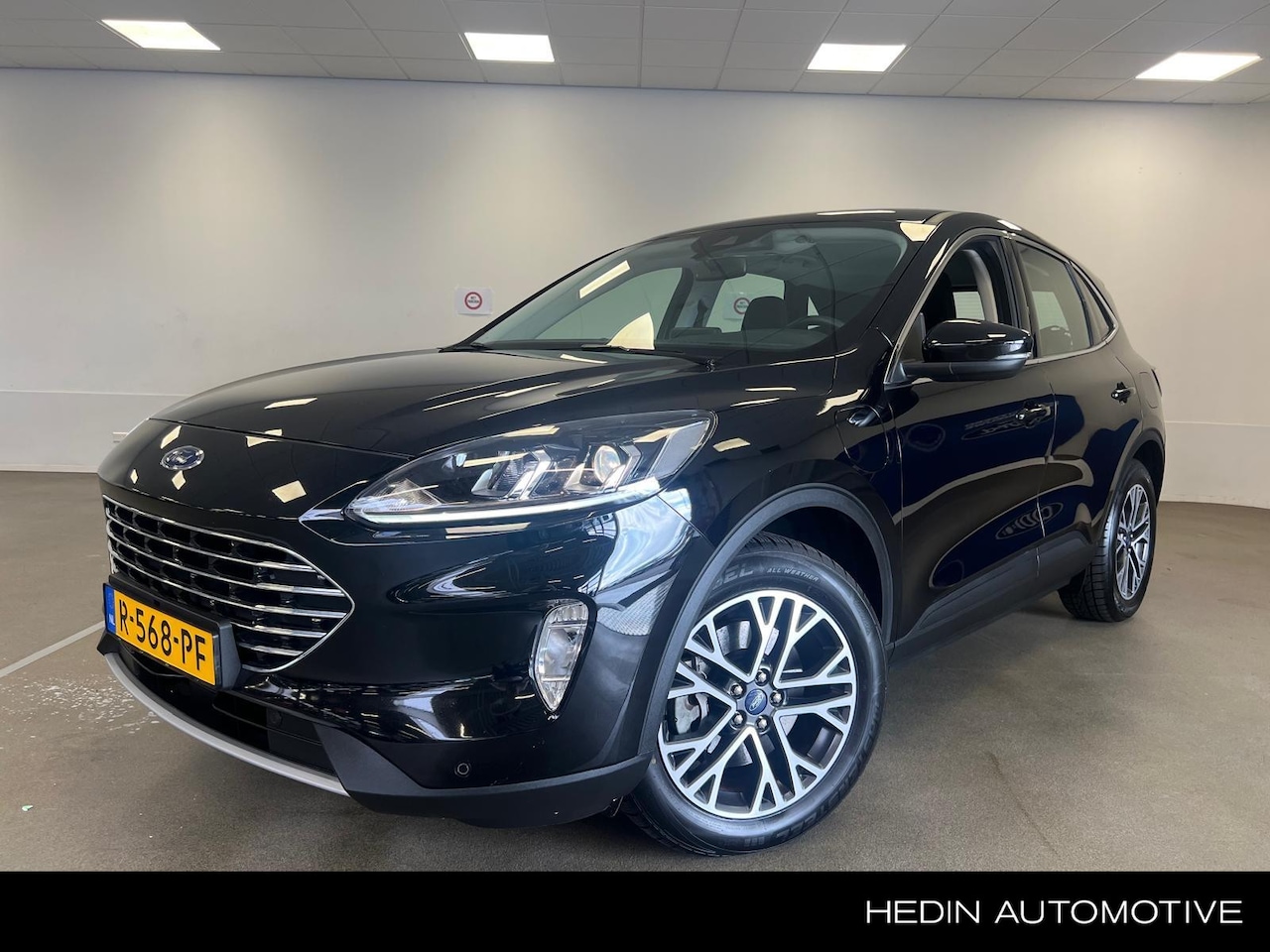 Ford Kuga - 2.5 PHEV Titanium Stoel / stuurverwarming | all season banden | 1 jr Bovag | keyless entry - AutoWereld.nl