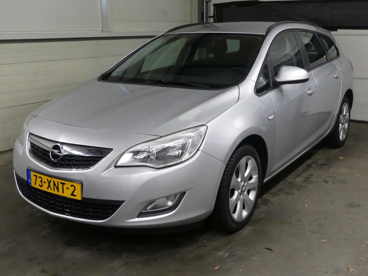 Opel Astra Sports Tourer - 1.4 Cosmo - Navigatie - Trekhaak - AutoWereld.nl