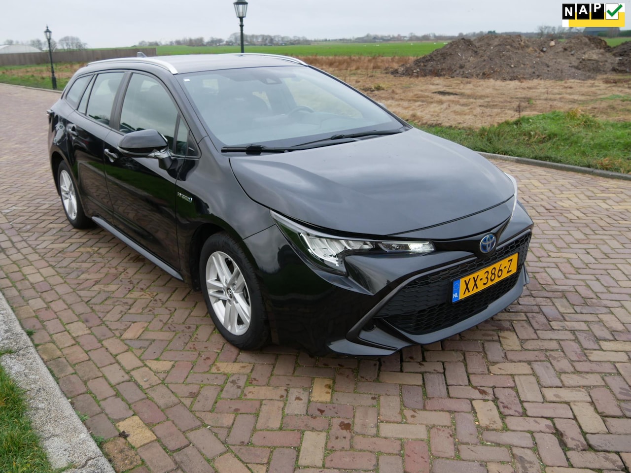 Toyota Corolla Touring Sports - 1.8 Hybrid Active CLIMA NAVI CAMERA *** 9699 NETTO *** - AutoWereld.nl