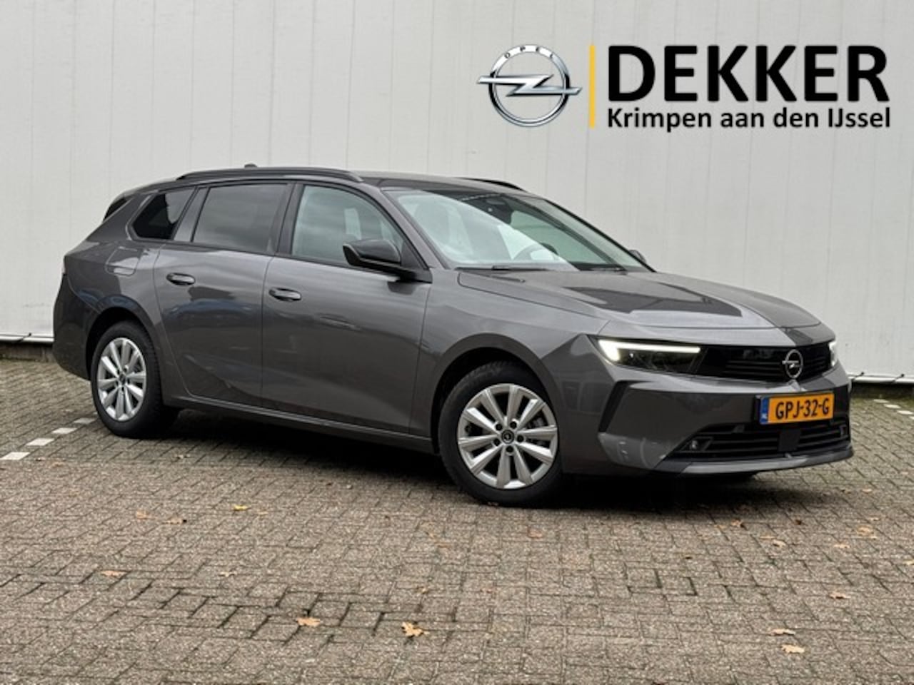 Opel Astra Sports Tourer - 1.2 Turbo Business Edition met Navi/Camera, Winterpakket, All Season - AutoWereld.nl