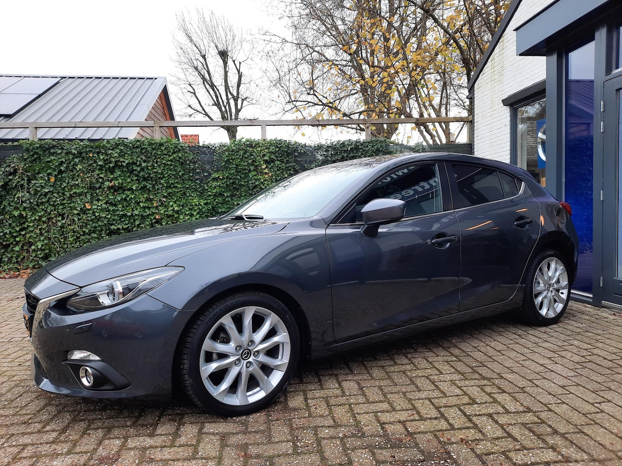 Mazda 3 - 2.0 GT-M Leer, PDC, Navi, Head-up - AutoWereld.nl