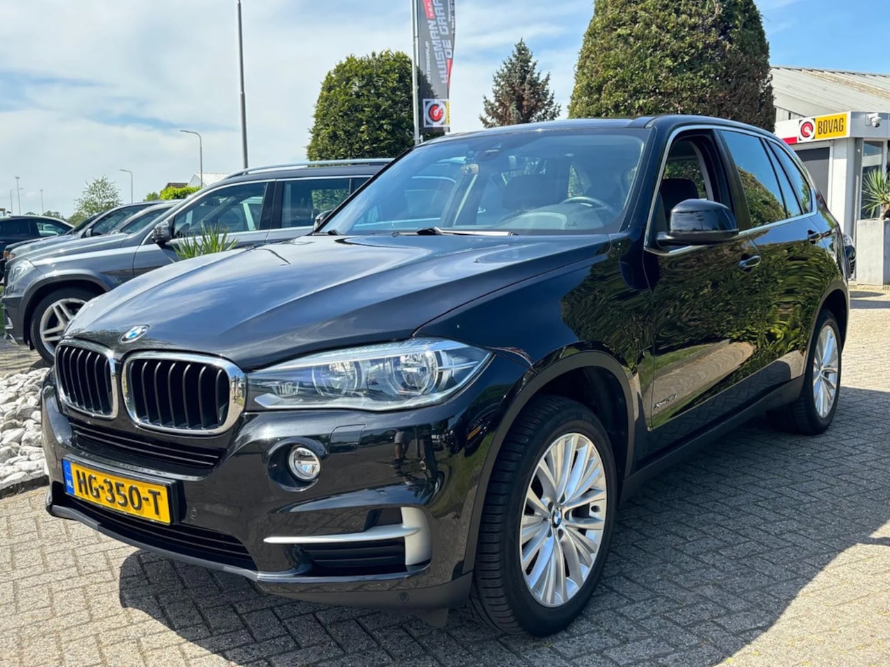 BMW X5 - 3.5i X-Drive High Executive 2015 Zwart NL Auto Trekhaak - AutoWereld.nl