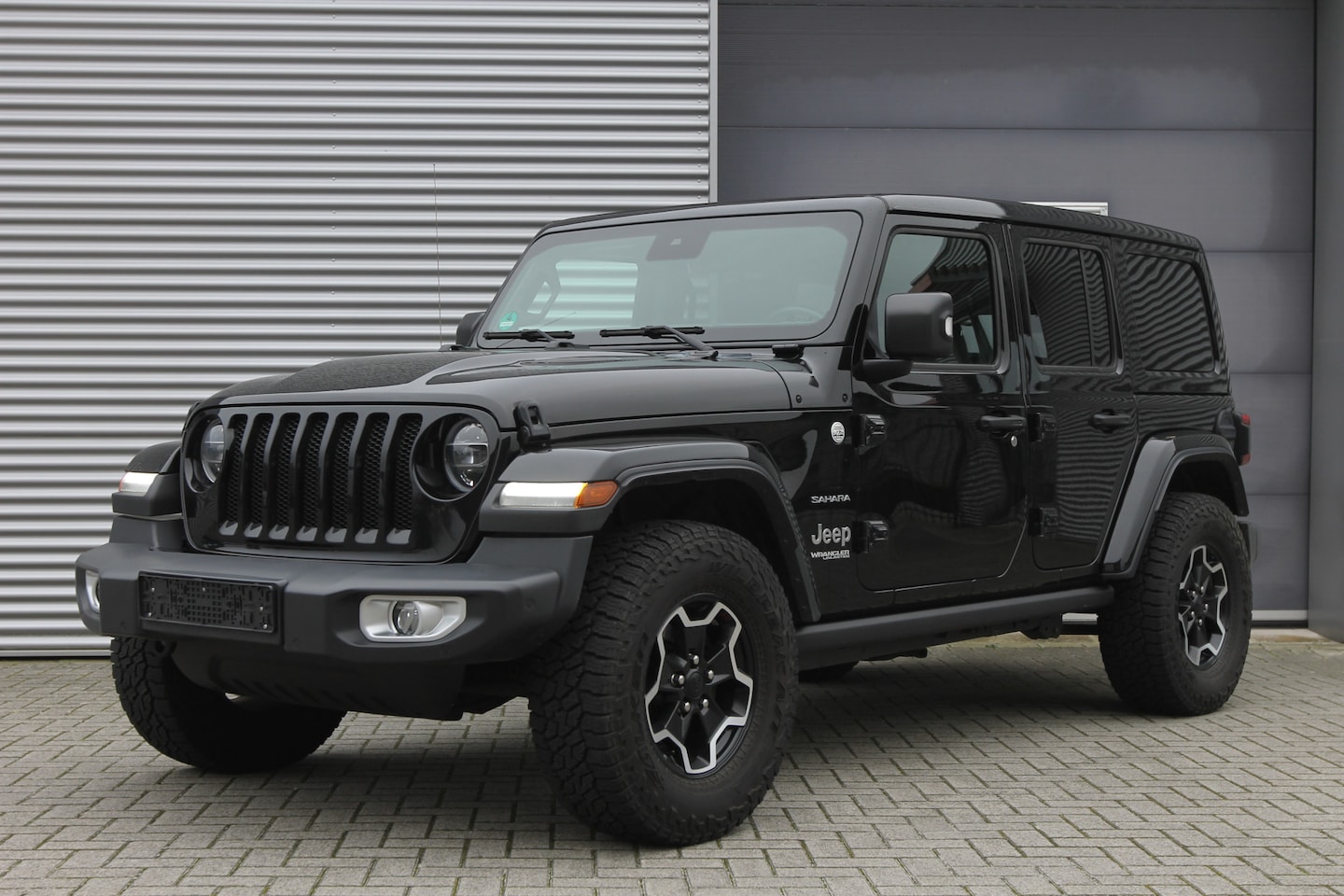 Jeep Wrangler Unlimited - 2.2D Sahara I AUT. I 4WD I OPEN SKY I LEDER I CARPLAY - AutoWereld.nl