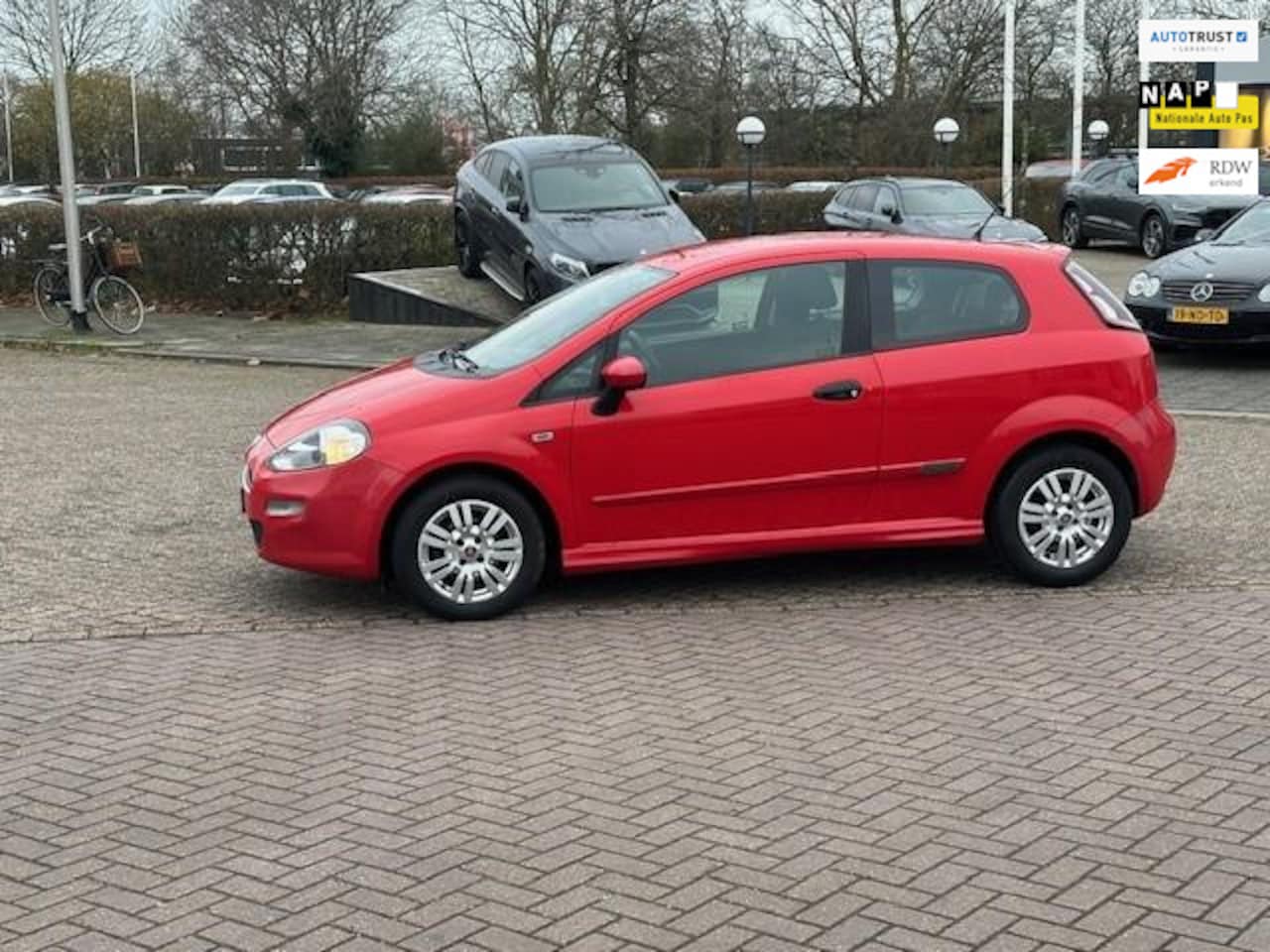 Fiat Punto Evo - 0.9 TwinAir Street 0.9 TwinAir Street,bj.2014,kleur:rood,airco,sportvelgen,NAP met 168711 km.en APK tot 06/20 - AutoWereld.nl