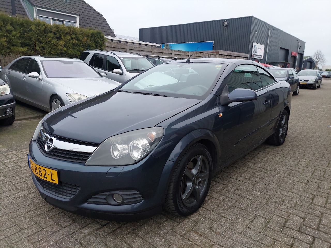 Opel Astra TwinTop - 1.6 Enjoy dak probleem weigert soms - AutoWereld.nl