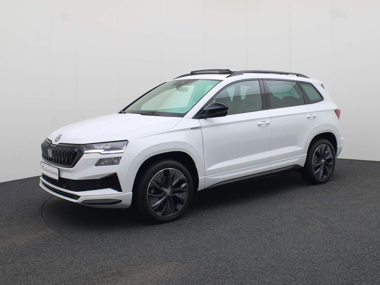 Skoda Karoq - 1.5TSI/150PK ACT Sportline DSG · Panoramadak · Zittingen verwarming · Navigatie · Garantie - AutoWereld.nl