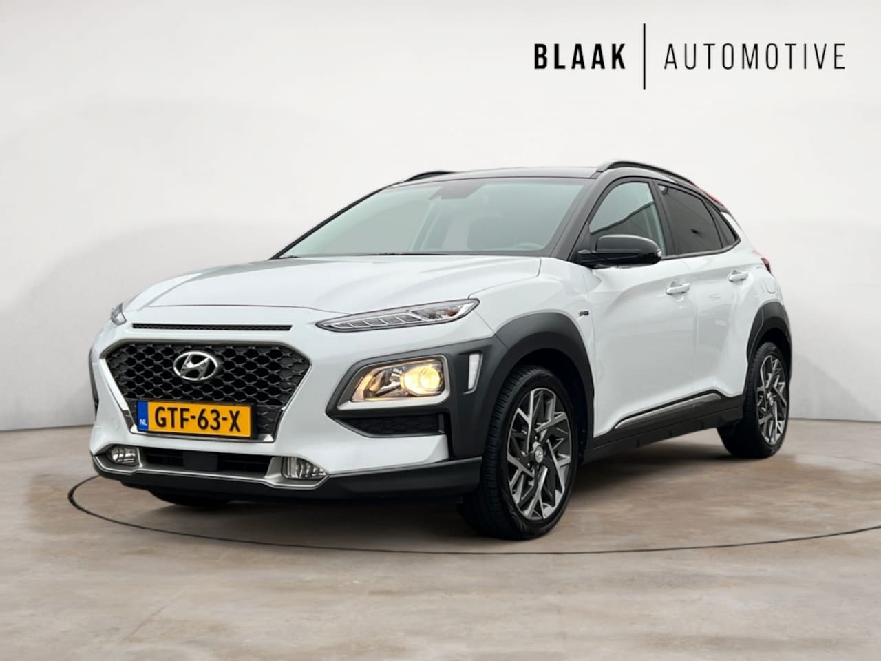 Hyundai Kona - 1.6 GDI HEV Fashion | HEAD-UP DISPLAY | NAVIGATIE | APPLE/ANDROI - AutoWereld.nl