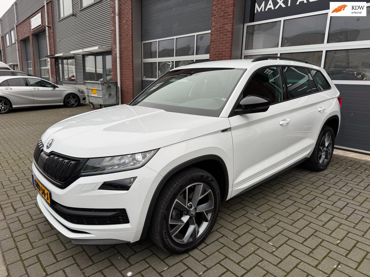 Skoda Kodiaq - 1.5 TSI Sportline DSG LED Navi Canton Memory - AutoWereld.nl