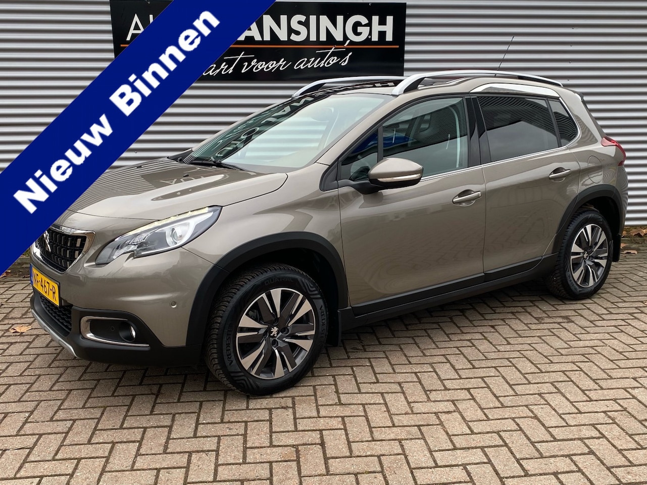 Peugeot 2008 - 1.2 PureTech Allure met panoramadak en 68.061km!! | Clima | Cruise | Navigatie | Lederen b - AutoWereld.nl