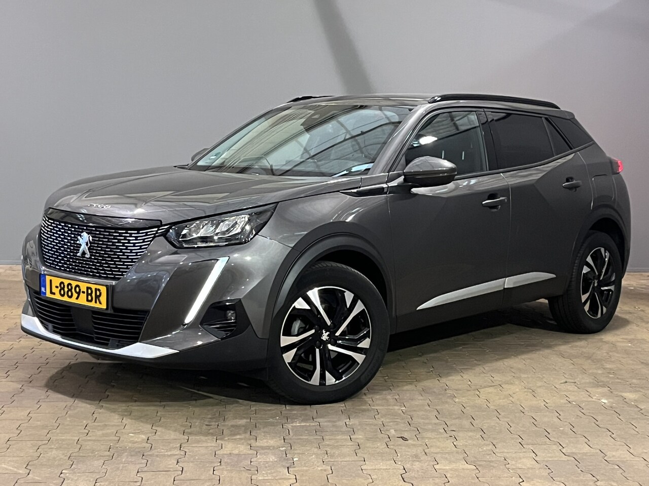 Peugeot 2008 - 1.2 Allure Pack | Navigatie | Digitaal Dasboard 3D | Climate - en Cruise Control | Lichtme - AutoWereld.nl