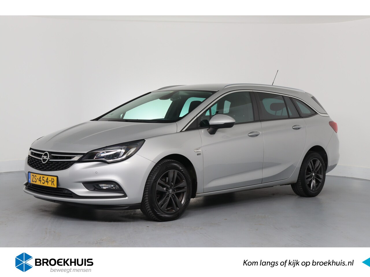 Opel Astra Sports Tourer - 1.0 Turbo 120 Jaar Edition | NAVI | PARKEERSENSOREN V+A | CLIMATE CONTROL | - AutoWereld.nl