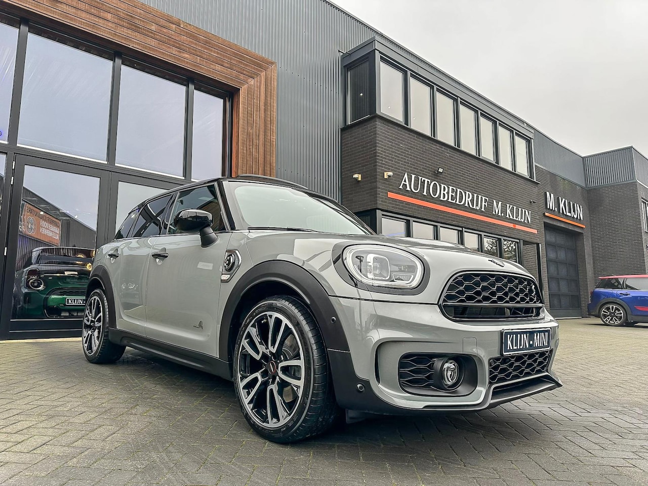 MINI Countryman - Mini 2.0 Cooper S E ALL4 John Cooper Works 220pk/Nardo/pano/camera/head up/btw - AutoWereld.nl