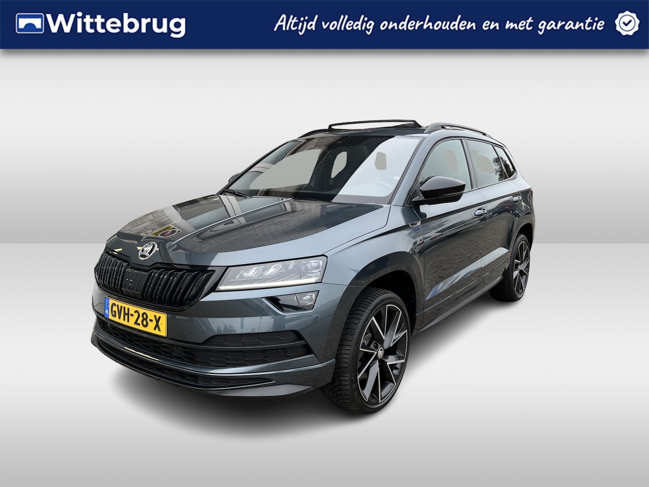 Skoda Karoq - 1.5 TSI ACT Sportline / AUTOMAAT/ PANO/ STANDKACHEL/ PARK. SENSOREN/ LED/ STOEL VERWARM. V - AutoWereld.nl