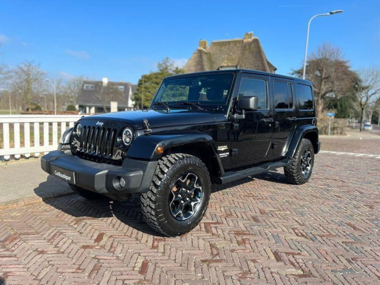 Jeep Wrangler Unlimited - 3.6 Sahara I Cruise Control I Leer I Rubicon Wielen I Led I - AutoWereld.nl