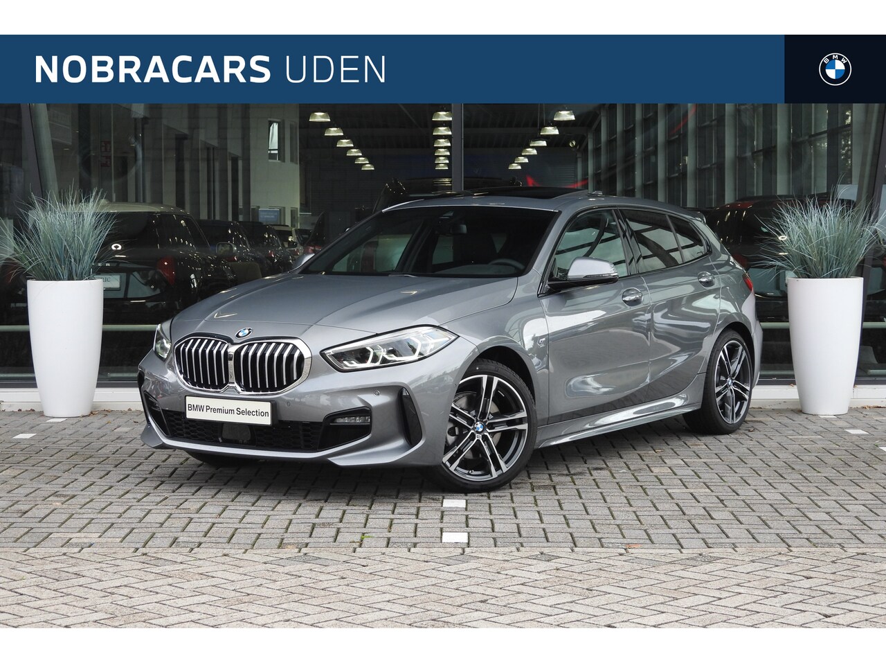 BMW 1-serie - 118i High Executive M Sport Automaat / Panoramdak / Trekhaak / Sportstoelen / Stoelverwarm - AutoWereld.nl