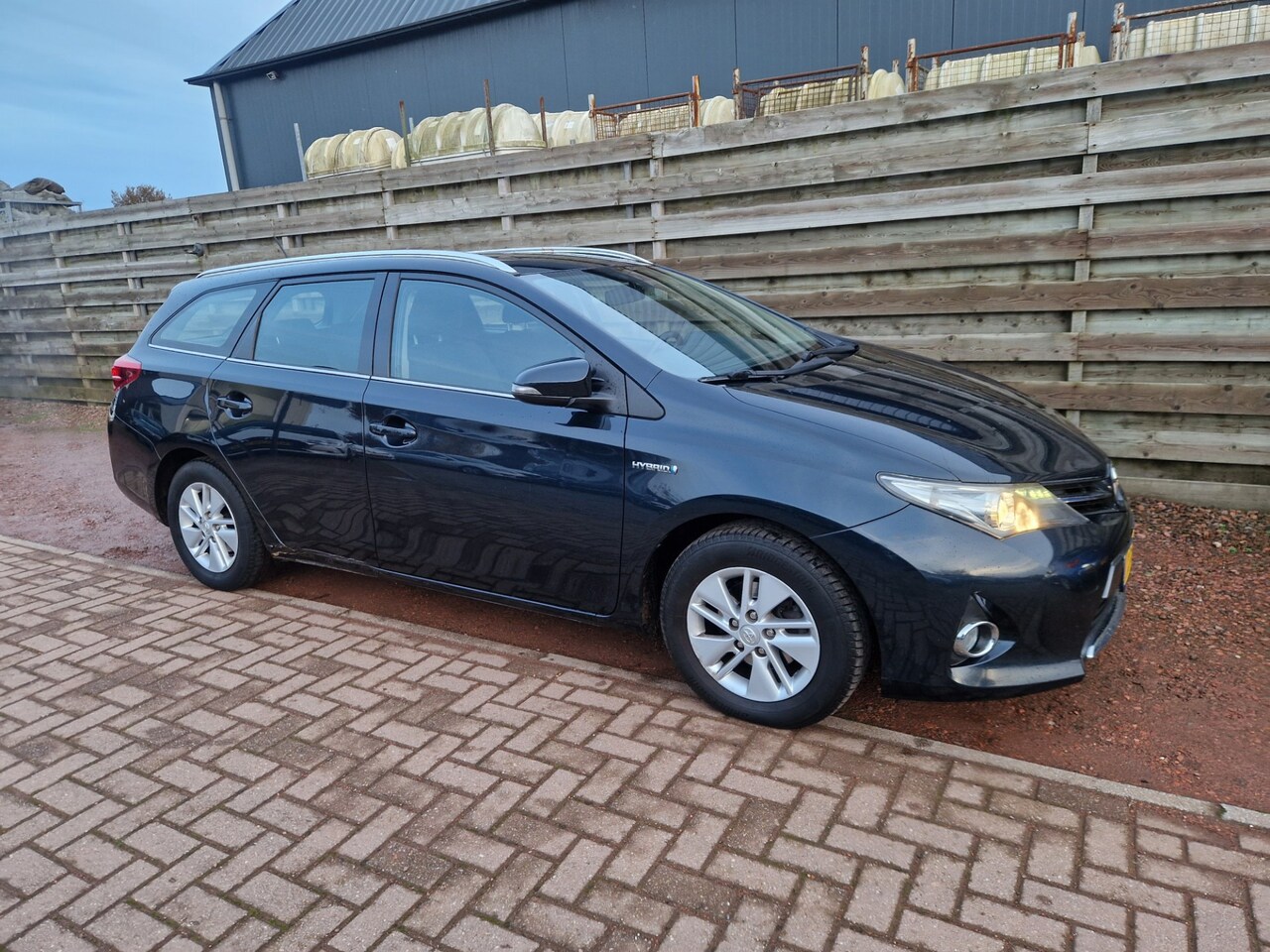 Toyota Auris Touring Sports - 1.8 Hybrid Aspiration Navigatie - AutoWereld.nl