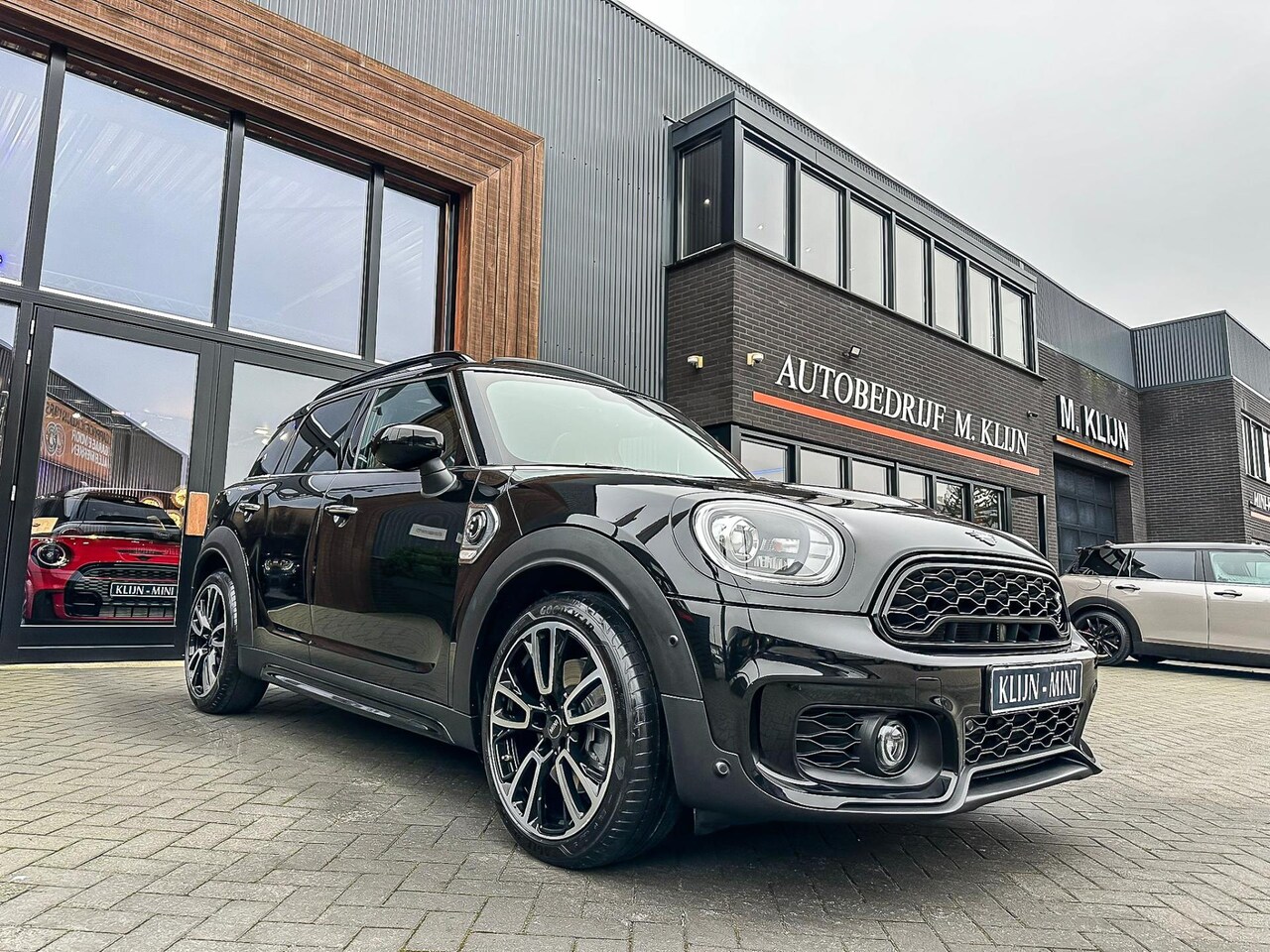 MINI Countryman - Mini 2.0 Cooper S E ALL4 John Cooper Works 224pk/pano/camera/Jcw int/19"Jcw/nieuwstaat - AutoWereld.nl