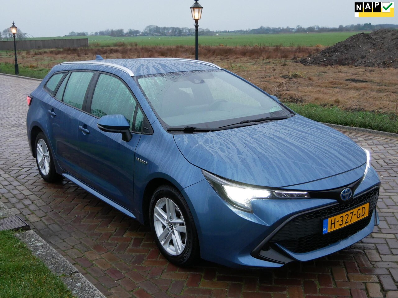 Toyota Corolla Touring Sports - 1.8 Hybrid Active NAVI ** 11299 NETTO ** - AutoWereld.nl