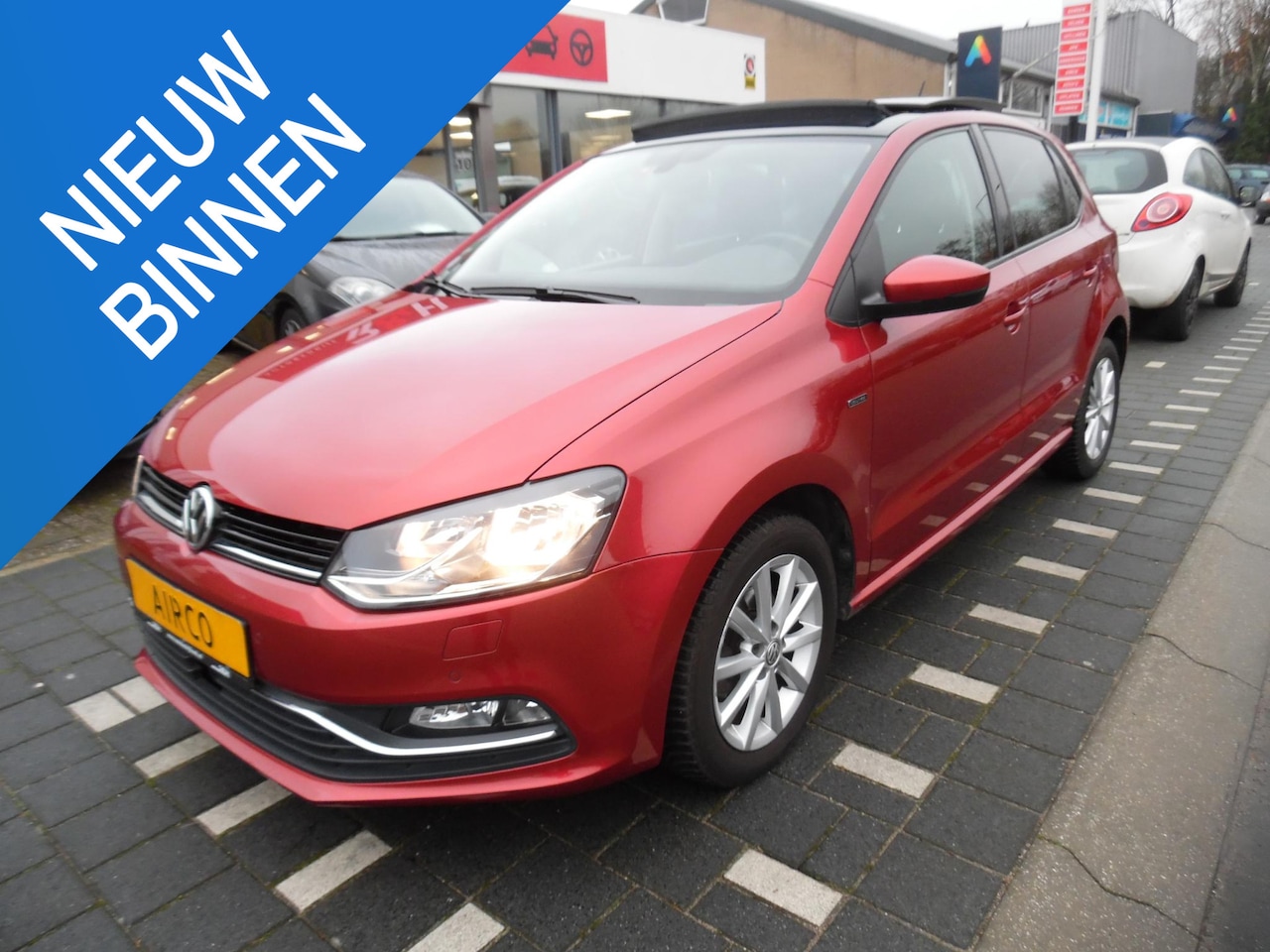 Volkswagen Polo - 1.2 TSI lounge automaat, cruise control, airco, stoelverwarming, sportvelgen, elektrisch, - AutoWereld.nl